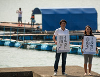 Satoshi & Sakura protest against the dolphin hunt  in Taiji, Japan
